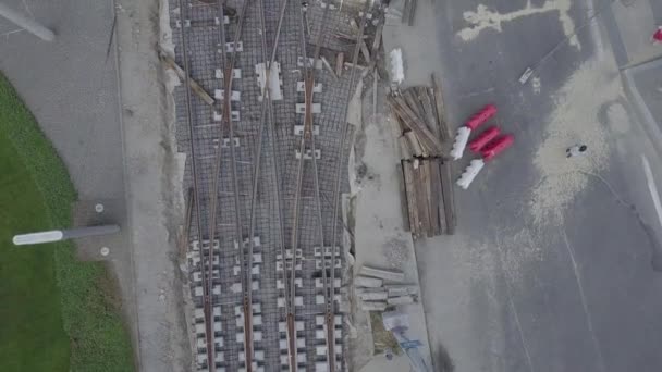 Road reconstruction with tram rails intersection, construction site — Stock Video