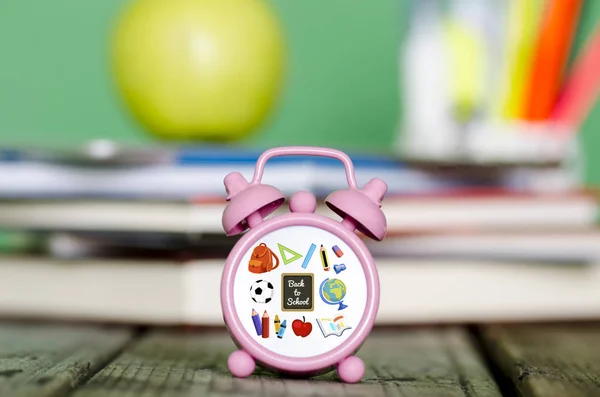 Back to school illustration on small clock with pile of books, g — Stock Photo, Image