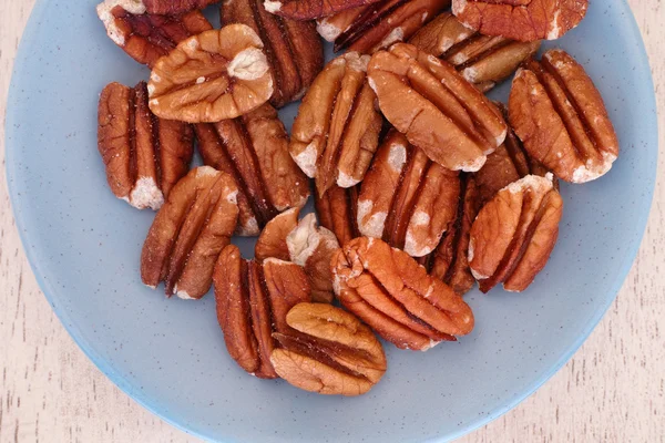 Pecan nuts in a plate — Stock Photo, Image