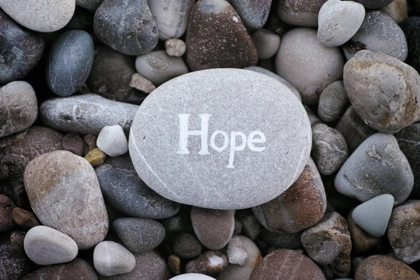 Stone with the word Hope on stone background — Stock Photo, Image