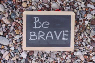 Phrase Be Brave on blackboard clipart