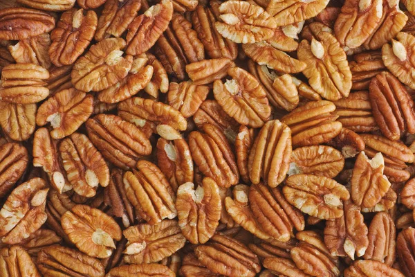 Lots of raw organic pecan nuts — Stock Photo, Image