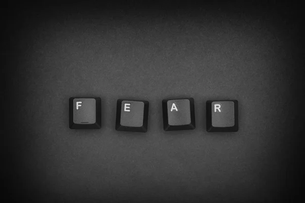Ordet "Rädsla" skrivs med dator tangentbordet för — Stockfoto