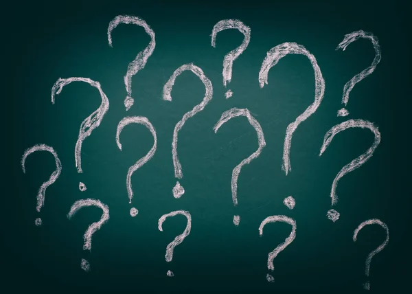 Question marks on chalkboard background — Stock Photo, Image