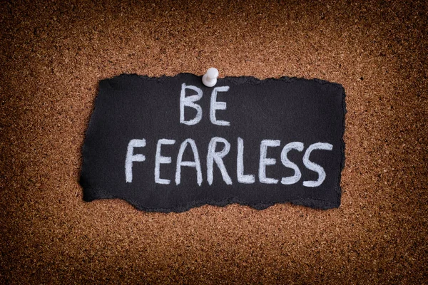 Piece of black paper with phrase Be Fearless — Stock Photo, Image