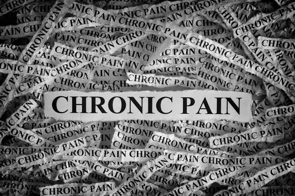 Torn pieces of paper with the words Chronic Pain — Stock Photo, Image