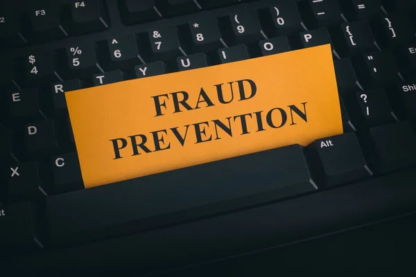 Yellow paper note on black keyboard with writing Fraud Preventio — Stock Photo, Image