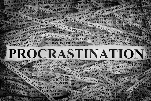 Torn pieces of paper with word Procrastination — Stock Photo, Image