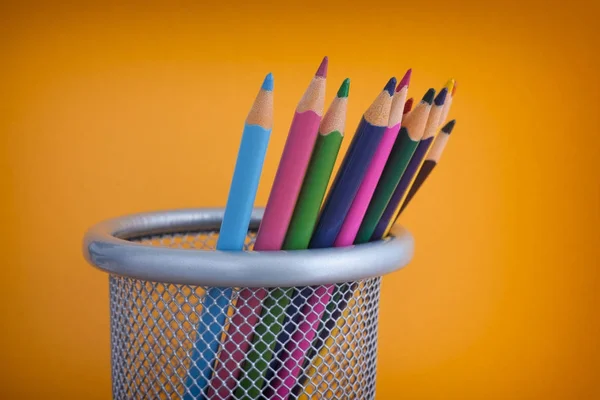Coloured pencils in a bin — Stock Photo, Image