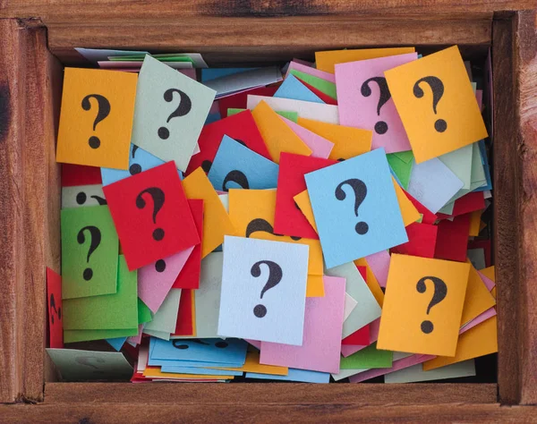 Question marks in a wooden box — Stock Photo, Image