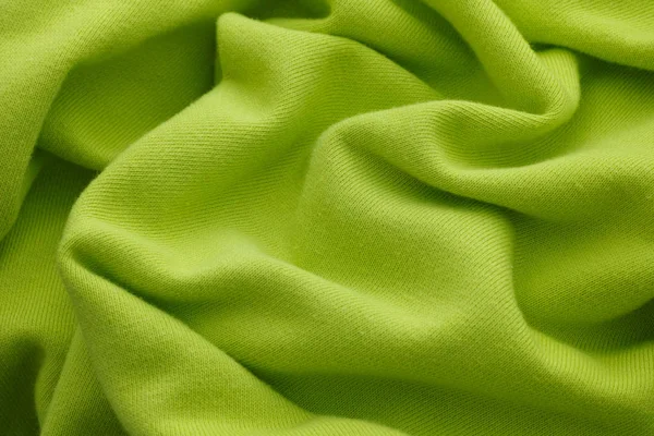 Lime green wrinkled fabric texture background — 스톡 사진