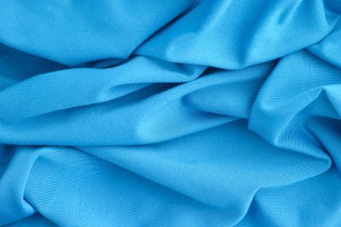 Mavi buruşuk kumaş dokusu arka planı. Kapat..