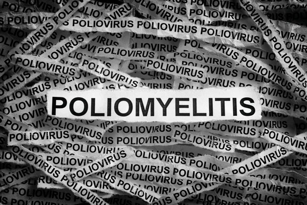 Strips of newspaper with the words Poliomyelitis and Poliovirus typed on them. Black and White. Close up.