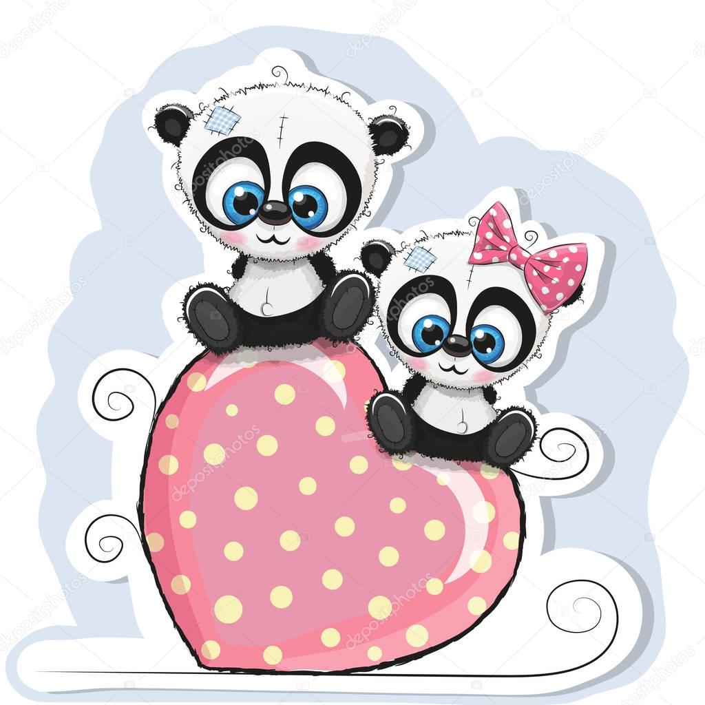 Two Pandas is sitting on a heart