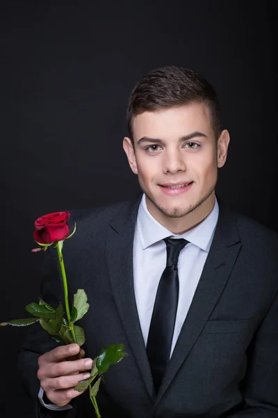 man with red rose