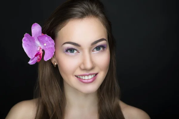Donna orchidea rosa brillante — Foto Stock
