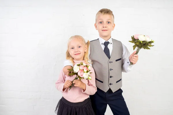 schoolboy with small bouquet