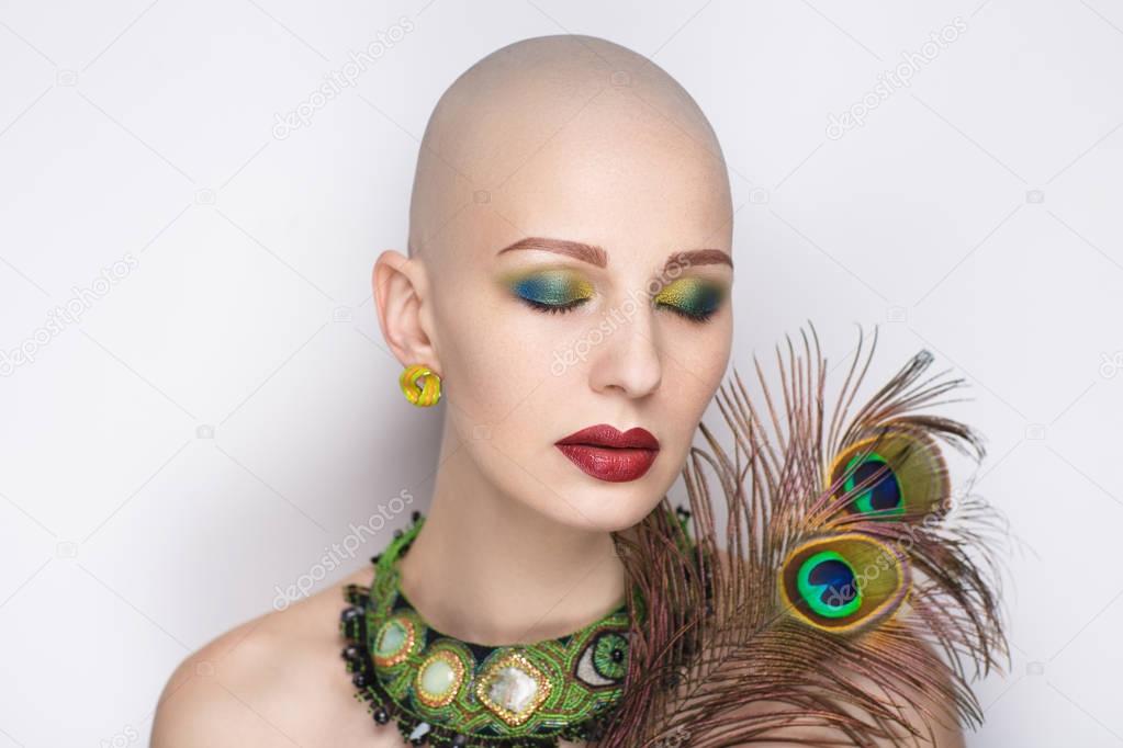 woman with peacock feathers