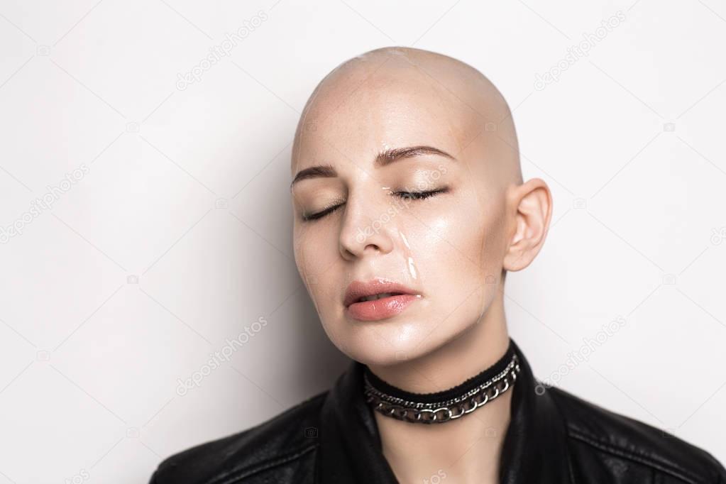wet bald woman