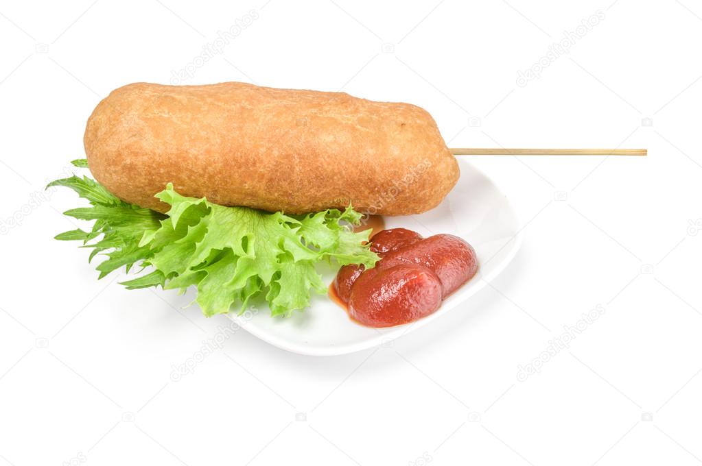 Corn dog with mustard isolated on white background cutout