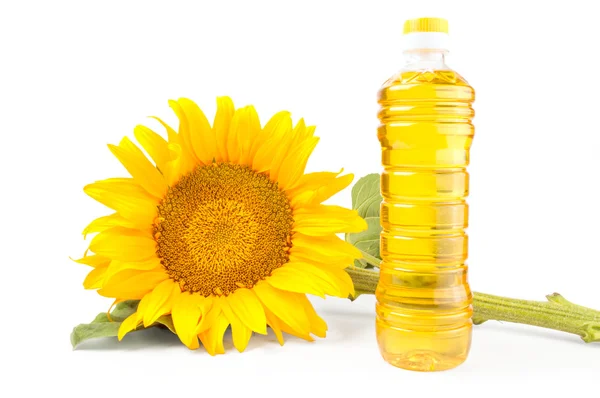 Bouteille d'huile de tournesol avec fleur isolée sur fond blanc — Photo