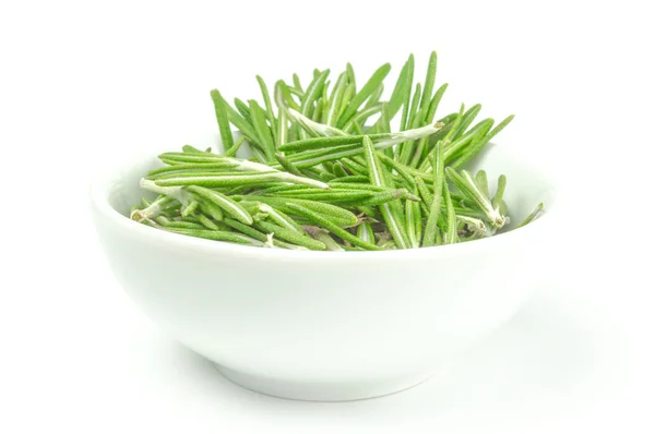 Fresh rosemary in a bowl on white background — Stock Photo, Image