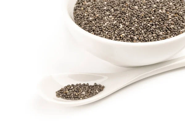 Bir beyaz arka plan kesme izole besleyici chia tohum