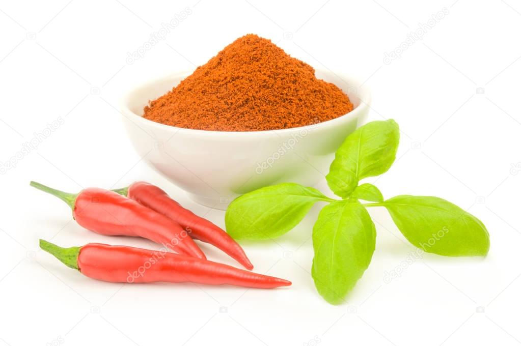 Red chili pepper powder on a white background. Clipping path