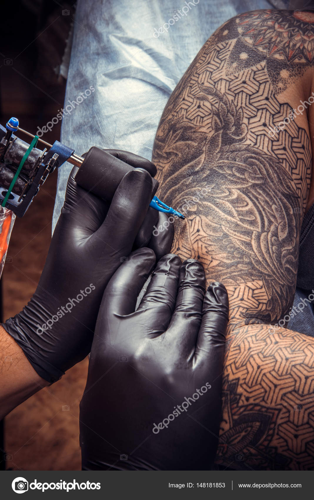 Tattooist at work in studio Stock Photo by ©Stop war in Ukraine! 148181853