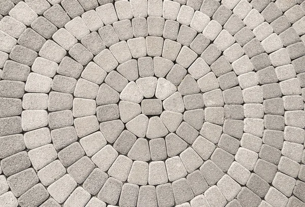 Kullersten trottoar med cirkulära mönster användbart för bakgrund — Stockfoto