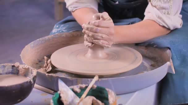 Creating a jar or vase close-up. Man hands making clay jug . The sculptor in the workshop makes a jug out of earthenware closeup. — Stock Video