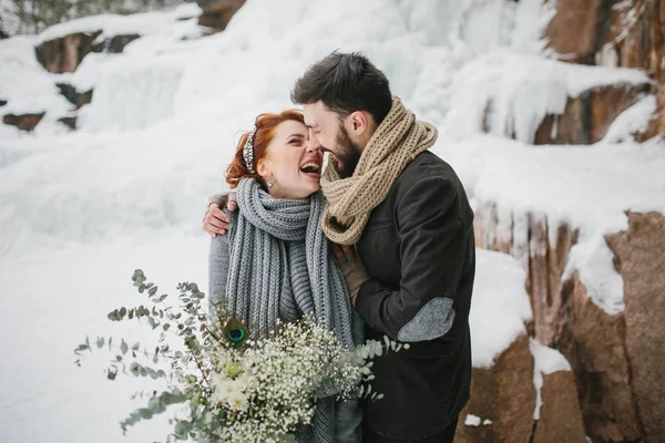 Young stylish couple embracing emotional. Winter