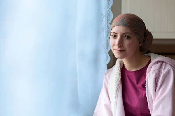 Young Positive Adult Female Cancer Patient Sitting Kitchen Window Smiling — Stock Photo, Image