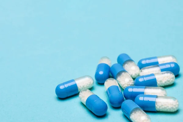 Medication Capsules Spilled Blue Pastel Coloured Background Medication Prescription Pills — Stock Photo, Image