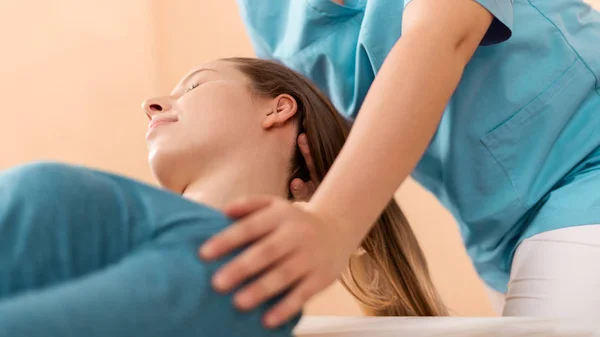 Female Physiotherapist Chiropractor Adjusting Patients Neck Physiotherapy Rehabilitation Concept Side — Stok fotoğraf