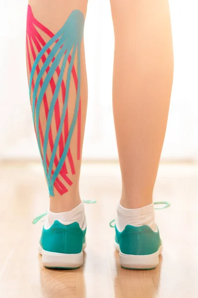 Female Patient Kinesio Tape Her Calf Standing Front Window Rear — 스톡 사진