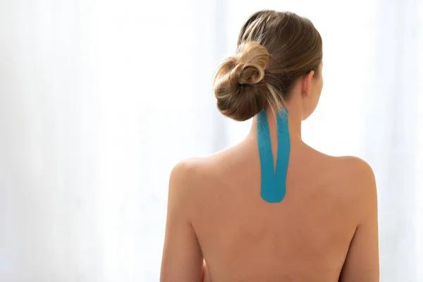 Female Patient Kinesio Tape Her Upper Back Neck Standing White — 스톡 사진