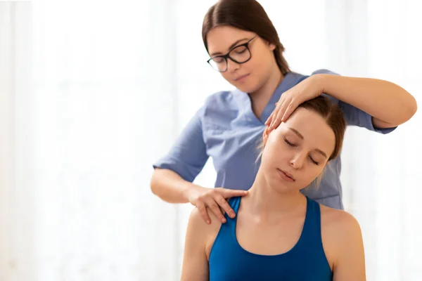 Female Physiotherapist Chiropractor Adjusting Patients Neck Physiotherapy Rehabilitation Concept White — Stok fotoğraf
