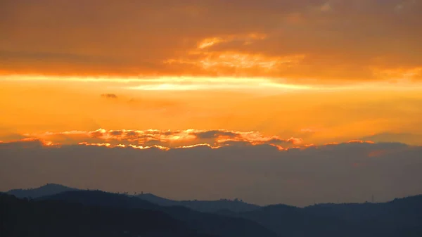 Orange clouds at sunrise — Stock Photo, Image