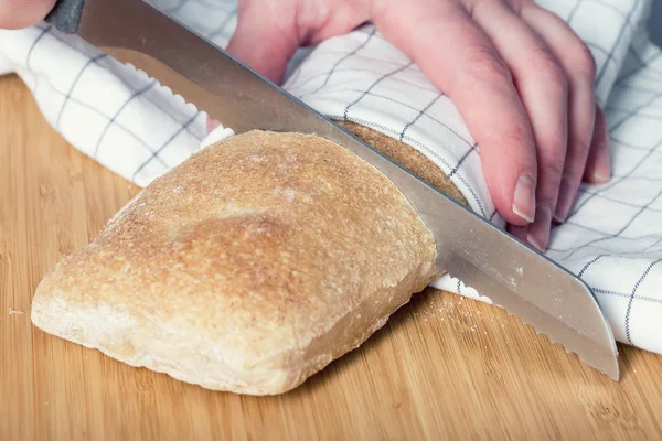 Slicing the ciabatta bread — Stock Photo, Image