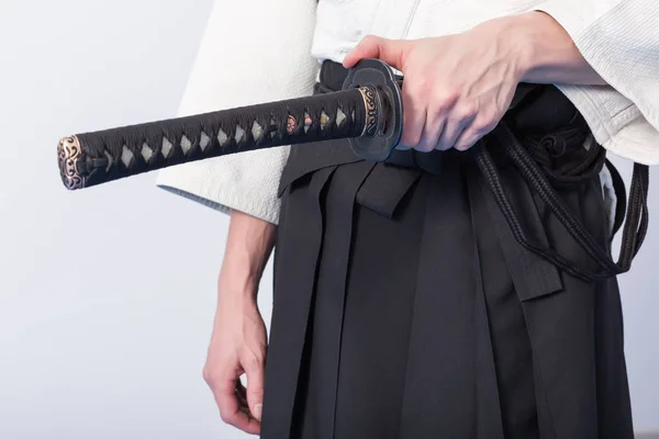https://st3.depositphotos.com/4211227/14702/i/450/depositphotos_147027703-stock-photo-hands-holding-the-katana.jpg