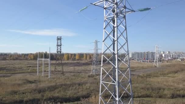 Flying up the high voltage electricity tower and power lines — Stock Video