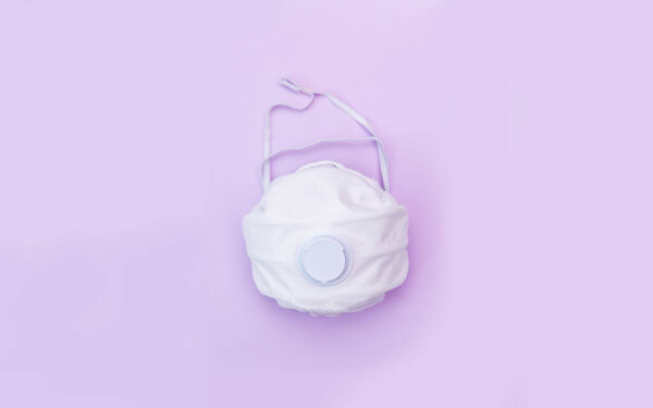 White medical mask on color background. A protection against pollution, virus, flu and coronavirus