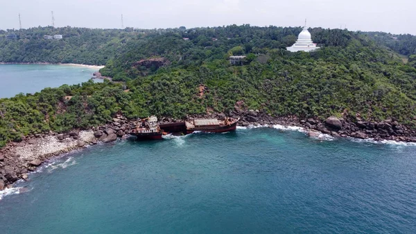 The rusty shipwreck run aground. Sri Lanka