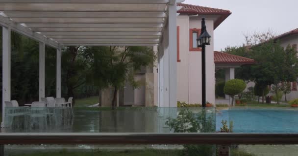 Rainy day on beautiful villa with a swimming pool — Stock Video