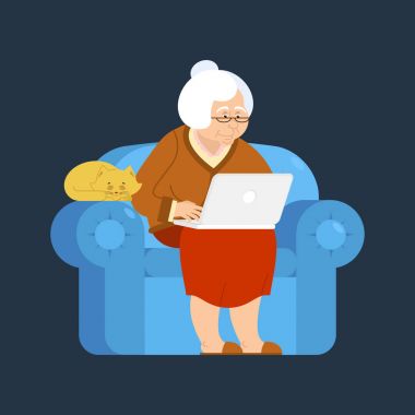 Büyükanne ve dizüstü bir koltuk. yaşlı kadın ve pc. Büyükanne bir
