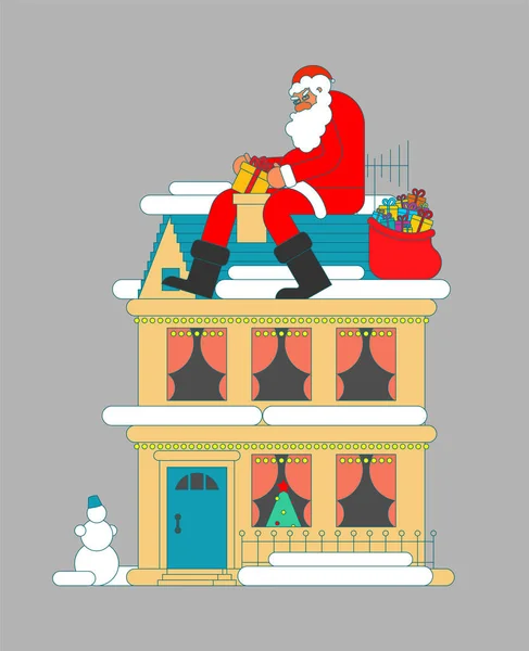 Santa on roof puts gift in chimney. Christmas and New Year. Xmas — Stock Vector