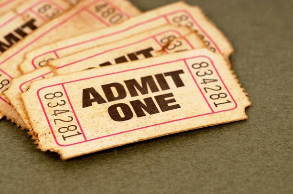 Old used torn admit one tickets