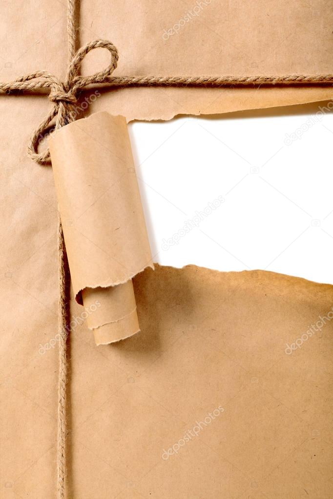Torn brown paper package background