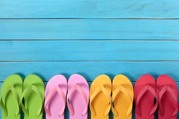 Flip flops with blue decking — Stock Photo, Image